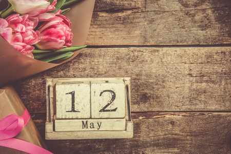 Mother's day concept - flowers, present, calendar, copy spaceの写真素材