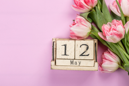 Mother's day concept - flowers, present, calendar, copy spaceの写真素材