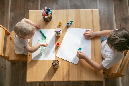 Kids painting with different materialsの写真素材