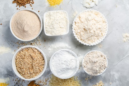 Gluten free concept - selection of alternative flours and ingredients, copy space