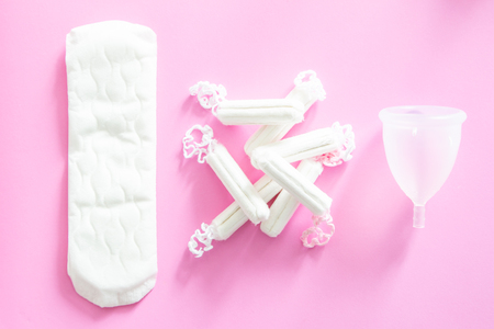 Zero waste concept - menstrual cup as alternative to tampons and traditional female hygiene, pinkの写真素材