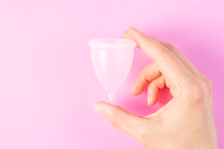 Zero waste concept - menstrual cup on pinkの写真素材