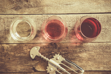 WIne tasting concept - red, rose and white wine in glassesの写真素材