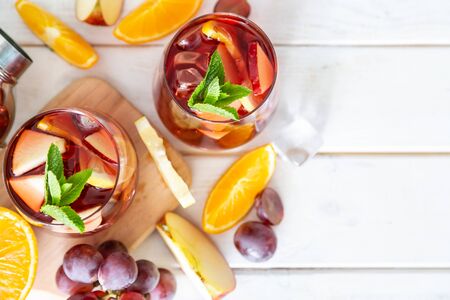 Sangria and ingredients in glasses on wood backgroundの写真素材