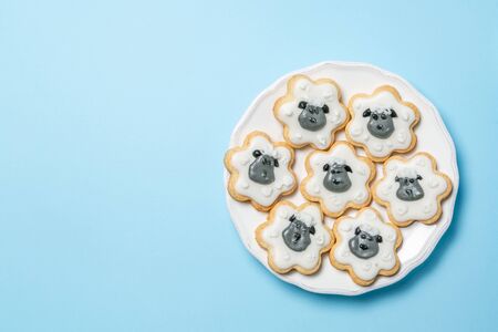 Eid Ad-Adha Mubarak holiday concept - cookies shaped like sheeps