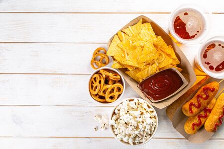 Selection of stadium game foods - nachos, pop corn, pretzels, corn dogsの写真素材
