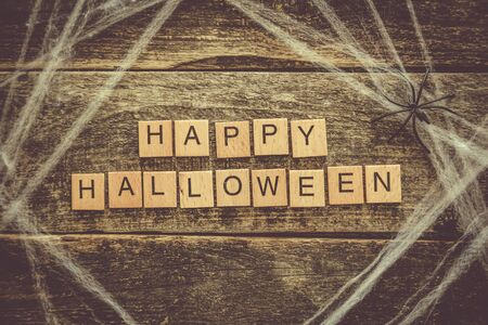 Halloween background - web on wood tableの写真素材