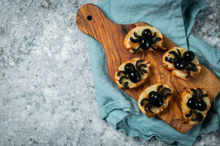 Halloween kids party food - mini pizza with spiderの写真素材