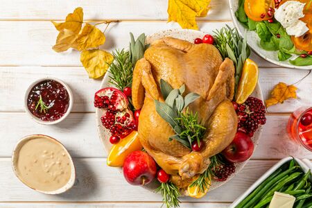 Selection of traditional thanksgiving food - turkey, mashed patatoes, green beans, apple pie on rustic background, top viewの写真素材