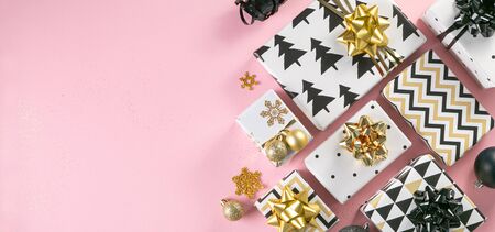 Selection of white, gold and black coloured christmas gift boxesの写真素材