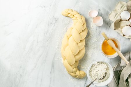 Making traditional jewish challah bread on marbleの写真素材