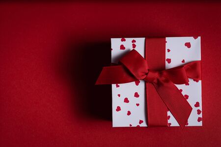 Vatentines day concept - present on red backgroundの写真素材