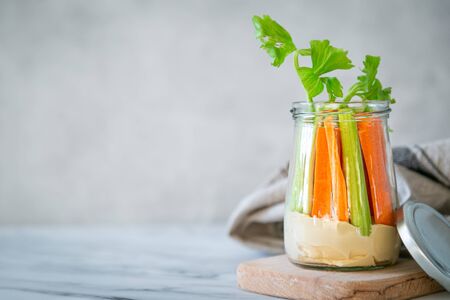 Zero waste snack - hummus with carrot and cilantroの写真素材
