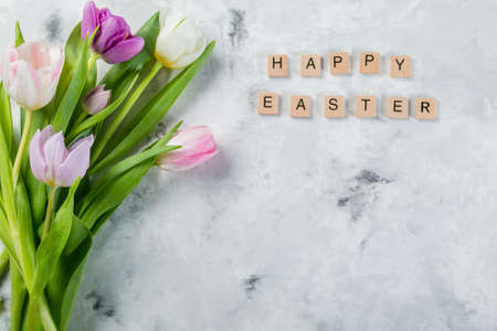 Easter concept - cookies with flowers on marble backgroundの写真素材