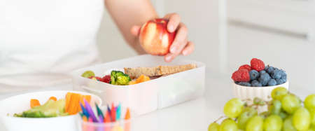 Back to school concept - mother making school lunchの写真素材