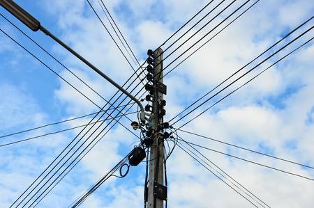 Electricity pylon with clouds and sky