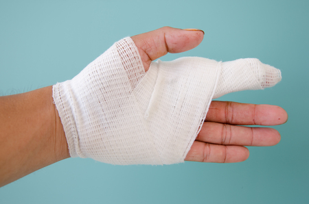 white medicine bandage on injury handの写真素材