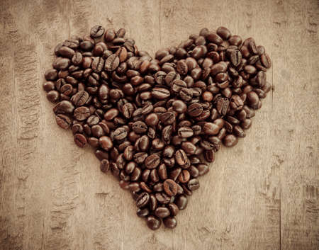 Roasted coffee beans in the shape of a heartの写真素材