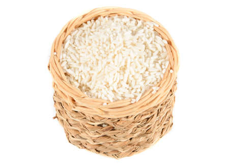 Basket of rice isolated on white backgroundの写真素材