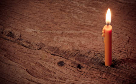 Candle on wooden backgroundの写真素材