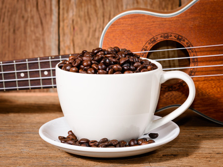 coffee cup and coffee beans and Ukuleleの写真素材