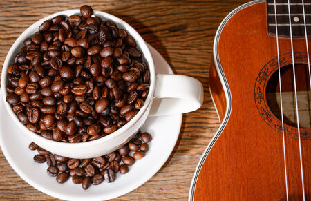 coffee cup and coffee beans and Ukuleleの写真素材
