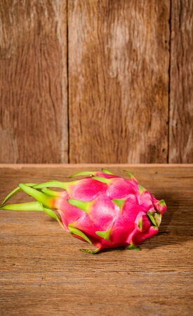 Dragon fruit on wood background, Hylocercus undatus (Haw) Brit. & Rose.の写真素材