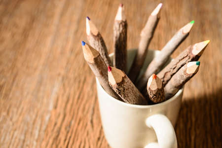 color pencil made of branches in coffee cupの写真素材