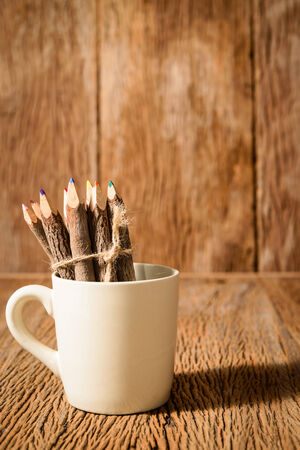 color pencil made of branches in coffee cupの写真素材