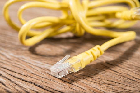 network cables on wood backgroundの写真素材