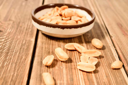 A bowl of roasted peanutsの写真素材