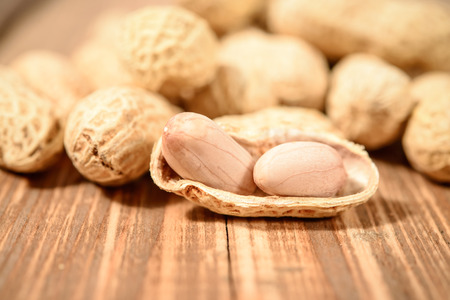 Peanuts on wood backgroundの写真素材