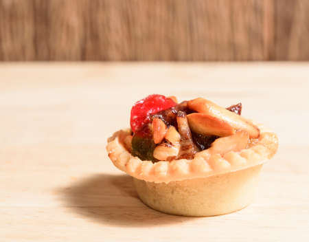 Fruit tart on wood backgroundの写真素材