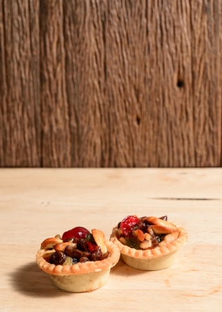 Fruit tart on wood backgroundの写真素材