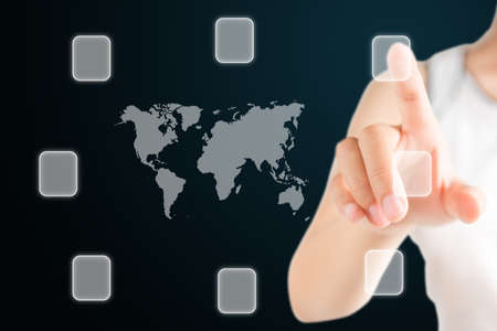Hand Woman touch the button around the world mapの写真素材