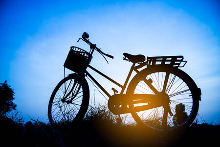 beautiful landscape image with Bicycle silhouette  at blue toneの写真素材