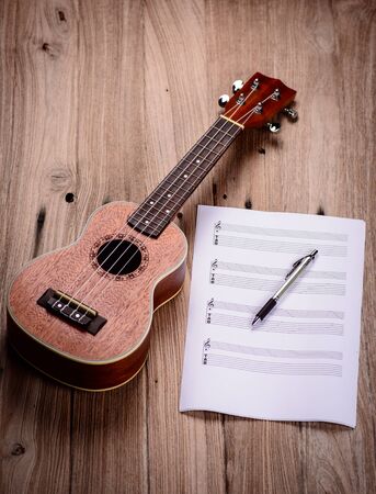 Ukulele and musical paper notesの写真素材