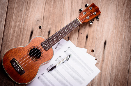 Ukulele and musical paper notesの写真素材