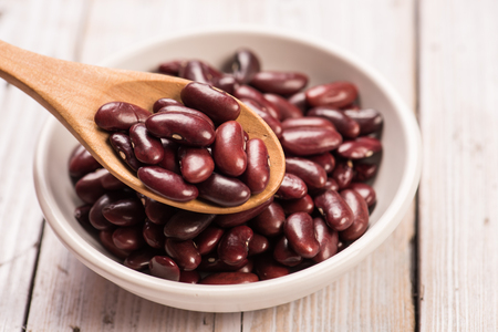 Kidney Beans in wooden spoon with ceramic bowlの写真素材
