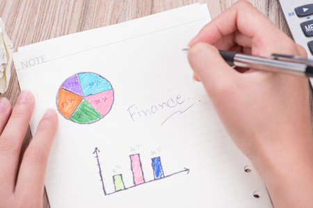 woman hand writing a graphの写真素材