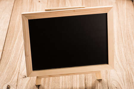 empty blackboard on wood table