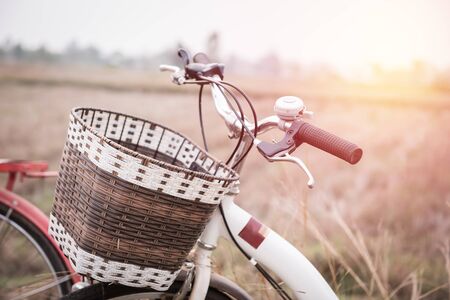 beautiful landscape image with Bicycle at sunset ; vintage filter styleの写真素材