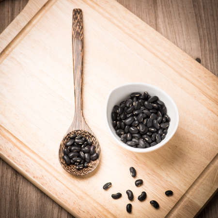 close up of black beans in ceramic bowl
