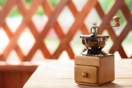 Antique Coffee Grinders on wood tableの写真素材