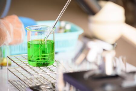 Laboratory glassware containing chemical liquid, science research