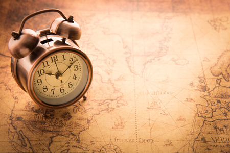 Classic Alarm clock on vintage map backgroundの写真素材