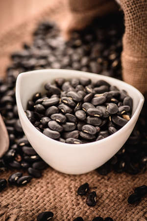 Vigna mungo or black beans with wooden spoon