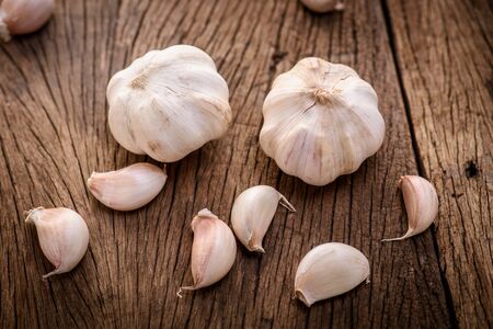 garlic on wood backgroundの写真素材