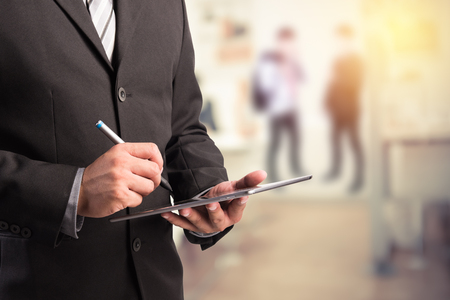 Business man working with a digital tabletの写真素材