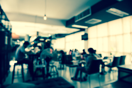abstract blurred people in coffee shopの写真素材